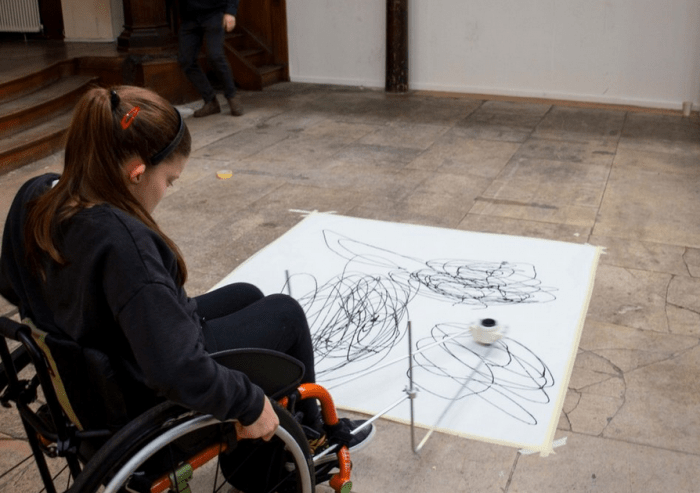 wheelchair user using the enayball