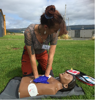 woman giving cpr to a dummy