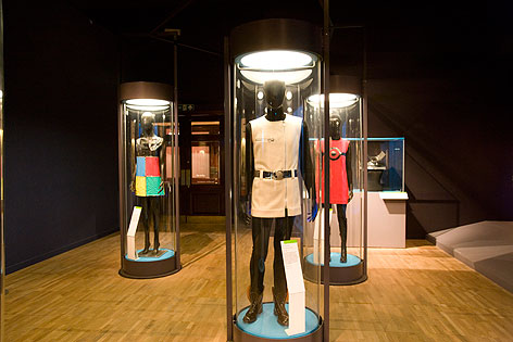 David Crowley's curated exhibition with space age tube displays of designed garments on mannequins.