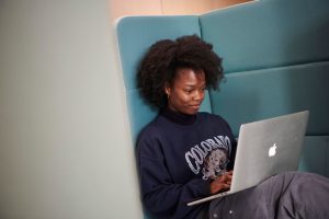 Student studying on laptop in Elm House