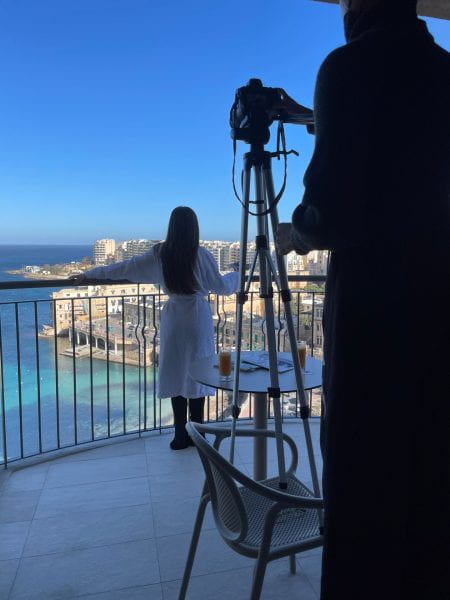 Woman on balcony in Malta on a photoshoot