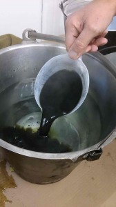 The pigment mix going into hot water.