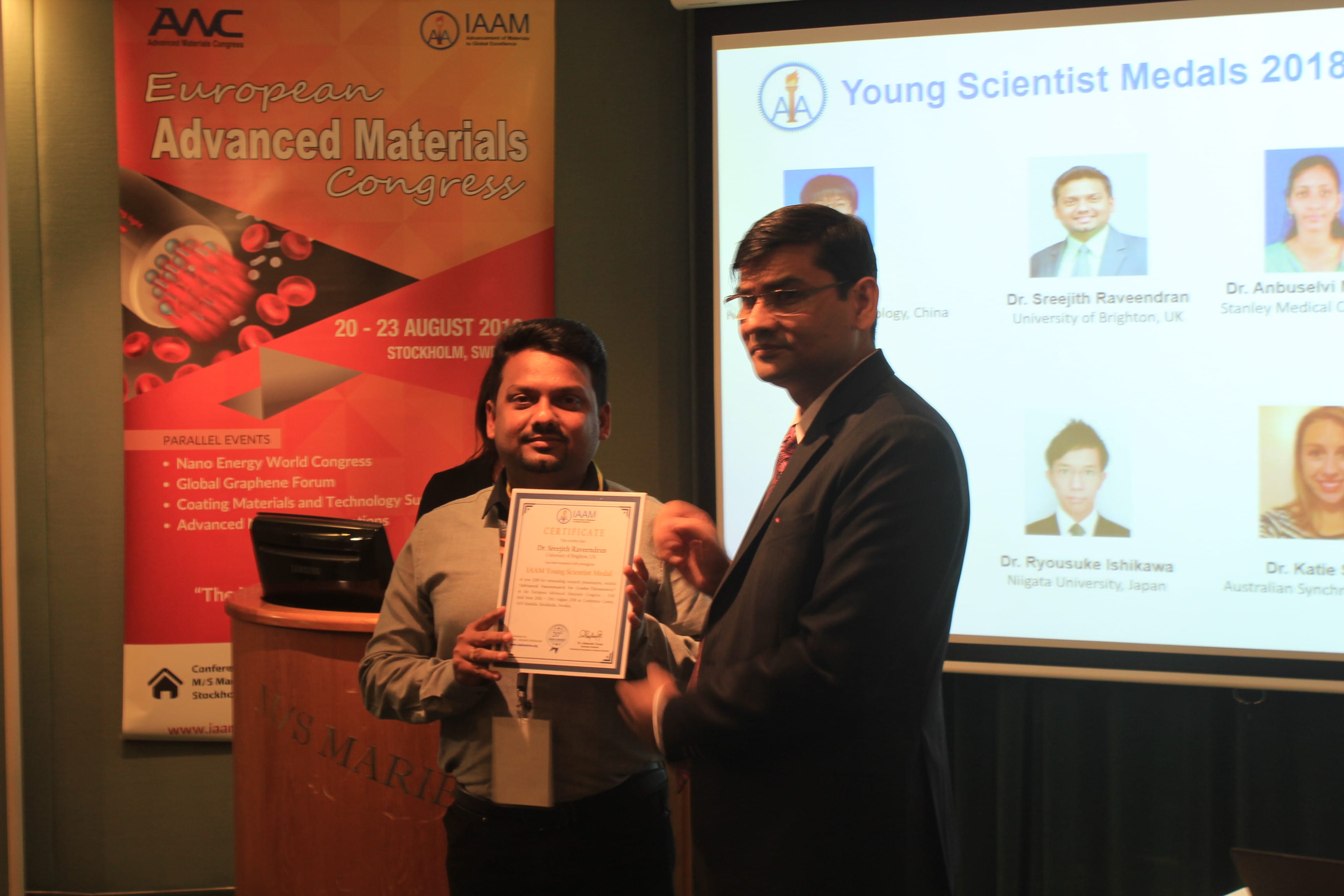 Dr Sreejith Raveendran receiving IAAM award
