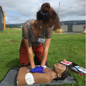woman giving cpr to a dummy