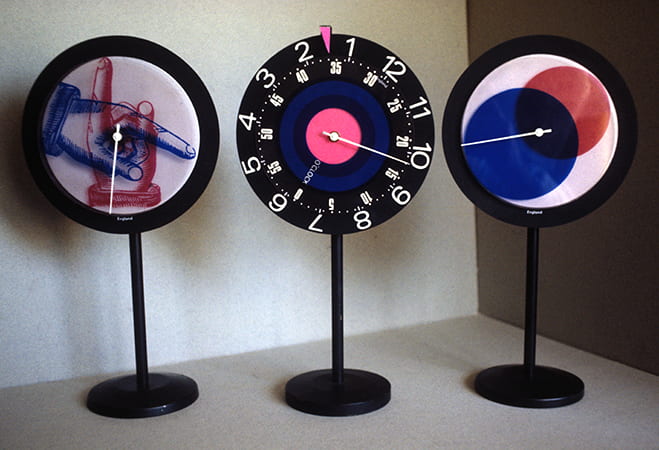 Colour photograph showing three standing clocks designed by Paul Clark. Taken from the Paul Clark Archive housed at the University of Brighton Design Archives.