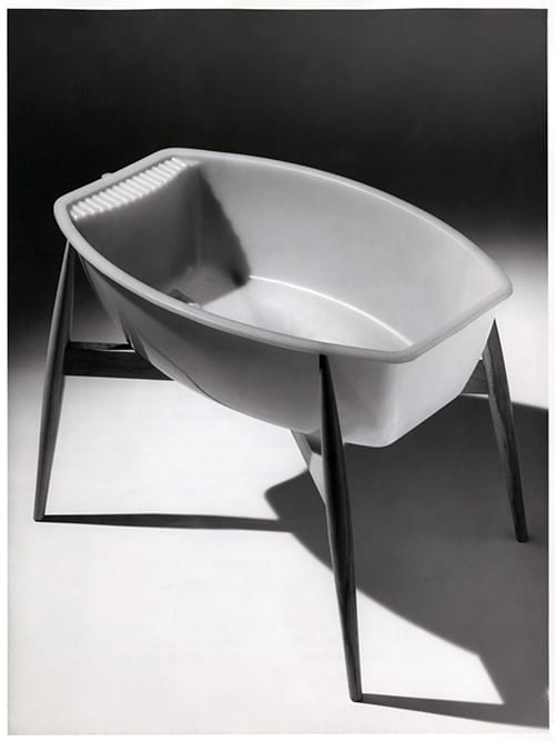 A black and white photographs showing an Ekco Gold Seal Superbath baby bath by Ekco Plastics Ltd. Designed by MO Rowlands MSIA. One of twenty products recognised in the COID 'Designs of the Year', 1958. Design Council Archive, University of Brighton Design Archives.