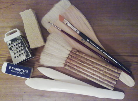 A colour image showing a selection of tools used in paper conservation. Taken by Sirpa Kutilainen of University of Brighton Design Archives.