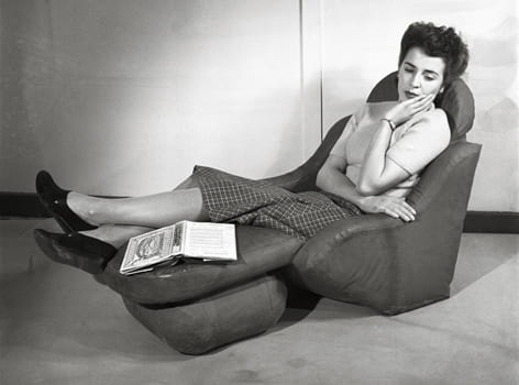 A black and white image of a woman on a reclining sofa chair. Taken from the Design Council Archive housed at the University of Brighton Design Archives.