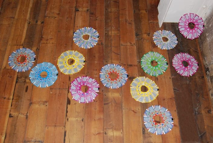 Scratchcards placed on the floor in colour-coded circles by Barbara Taylor for her work shown at the Keepers - an exhibition of personal collections exhibition held at The Basement, Brighton, in July 2011.