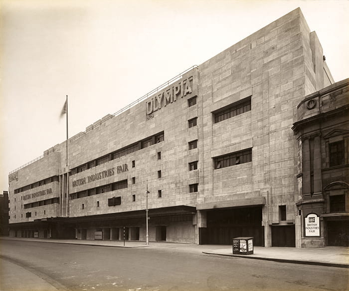 A black and white photograph of the exterior of the New Empire Hall, Olympia (1929-1930), designed by Joseph Emberton. Taken from the Joseph Emberton Archive housed at the University of Brighton Design Archives.