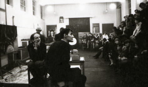 Black and white photograph of Anthony Froshaug teaching a class