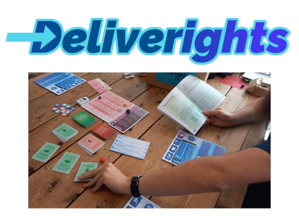 Image of a board game in play, with hands and cards and dice and a rule book. With word Deliverights above in blue text