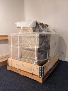 A pallet containing wrapped archival material.