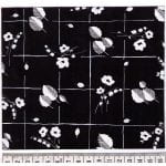 Fabric design small white flower punches and shapes on black background from Walter Fielden Royle collection