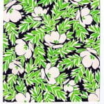 Fabric design with white flowers and green leaves from the Walter Fielden Royle collection