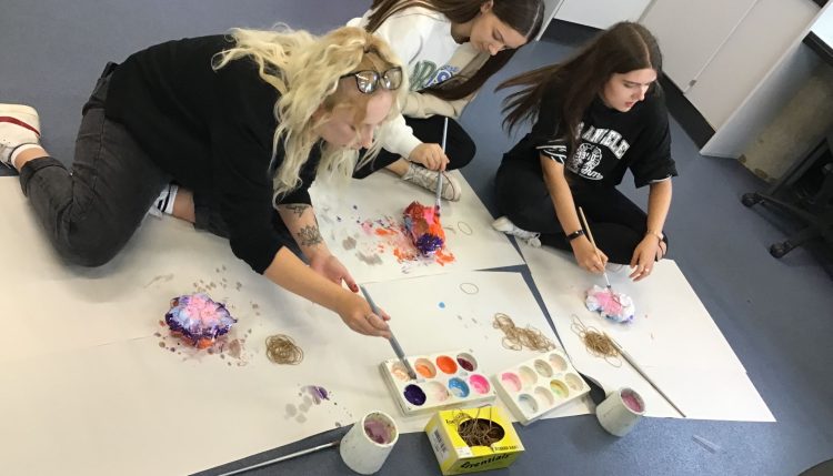 students painting