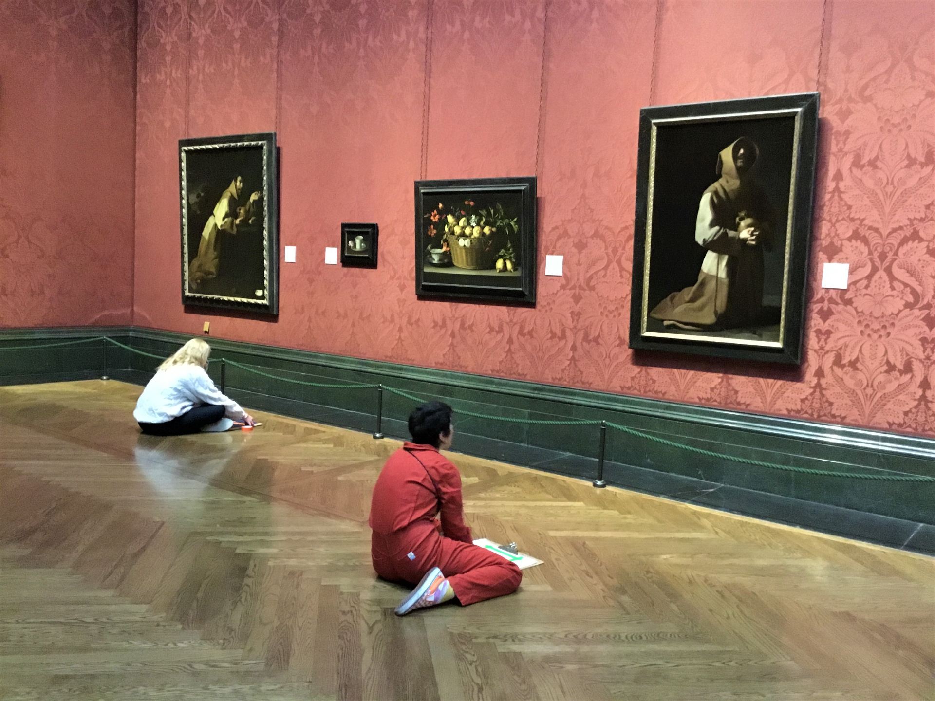 Trainees sitting on the floor in the National Gallery drawing