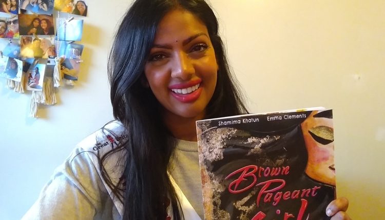 Shamima Khatun with copy of her book