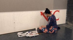 Emma painting walls