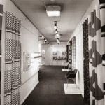 A corridor with fabrics on the walls