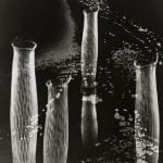 Four tall and stripey glass vases