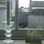 A glass candle holder and an ornamental glass piece from Finland