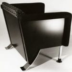 A boxy lounge chair with metal legs