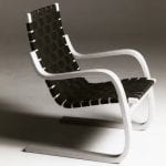 An iconic Alvar Aalto bent wood and woven easy chair