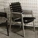 Two high-backed woven wooden chairs