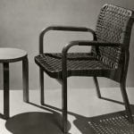 A woven single chair and a three-legged wooden stool