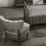 Black and white photo of a single bedroom setting showcase
