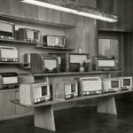 A black and white photo of a radio sales room in a department store