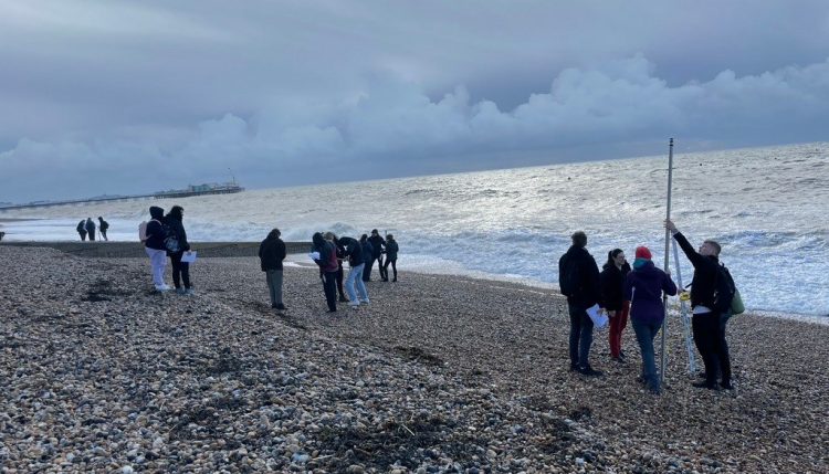 students by the sea on beach