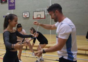 students doing an activity with string