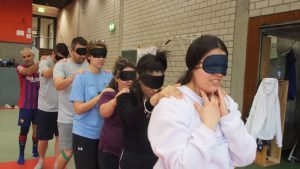 a group wearing blind folds