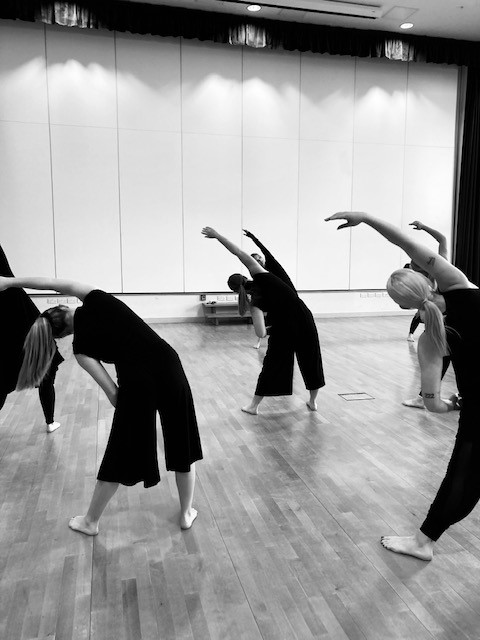 students stretching in the studio