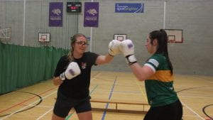 two female students sparring