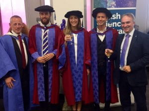 Dr Neil Maxwell and Dr Jessica Mee with graduates