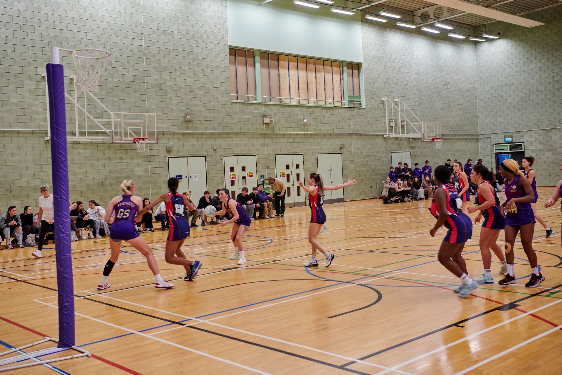 students playing netball in the sports hall