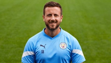 Sam in a Manchester City kit
