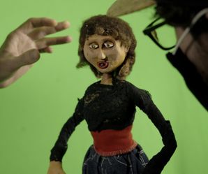 stop motion puppet being manipulated by artist