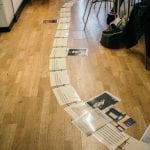 Timeline of text and images featuring basic history of neurodiversity placed on the floor