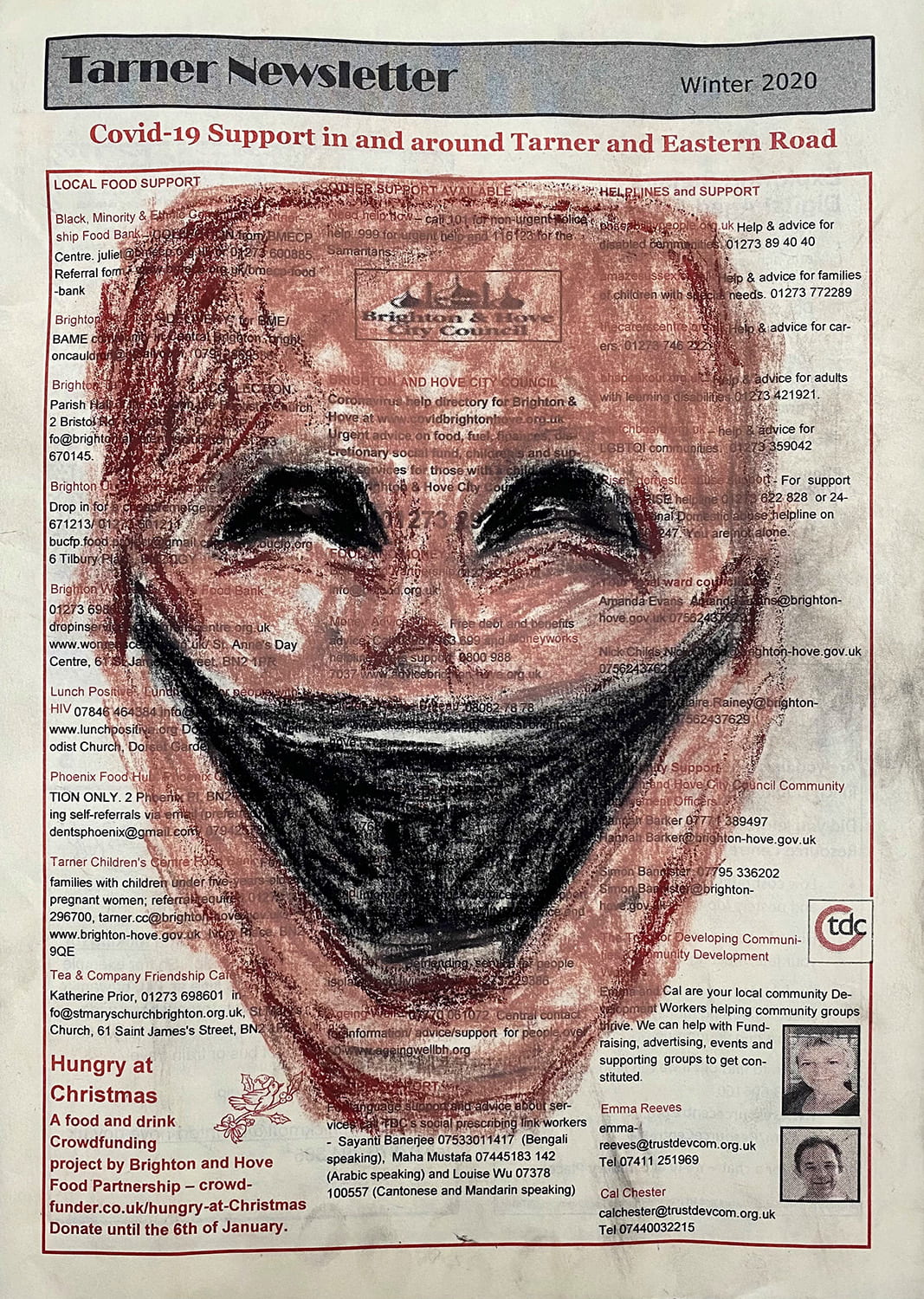Red laughing face on newsprint page