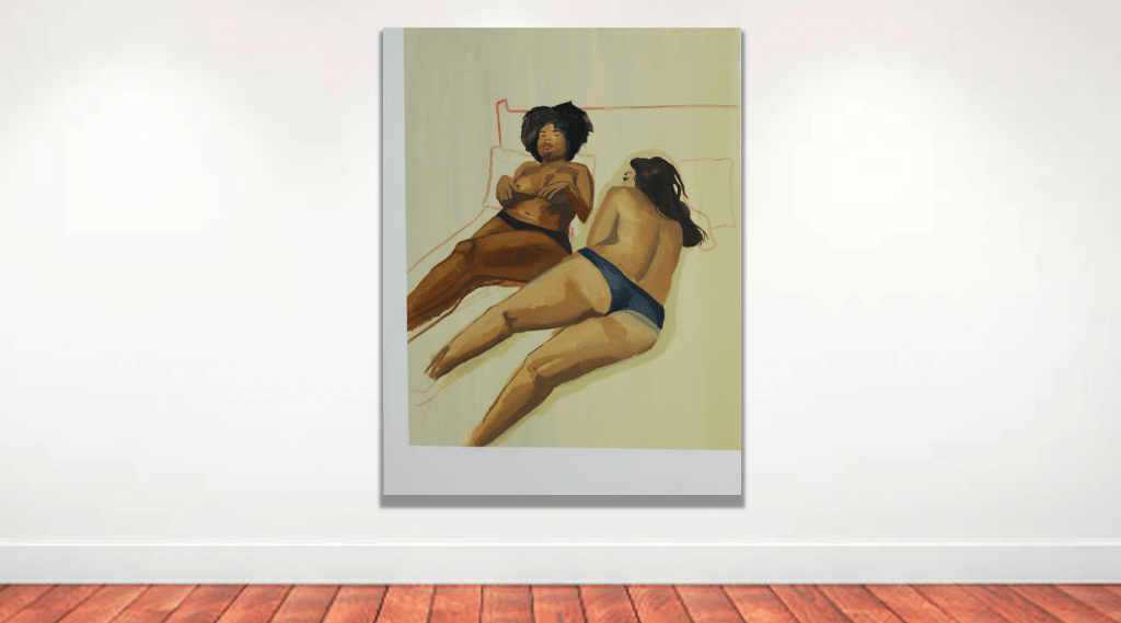 Two girls lying on a bed