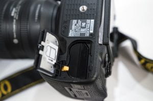 Image showing battery compartment on the underside of the Nikon D750 camera