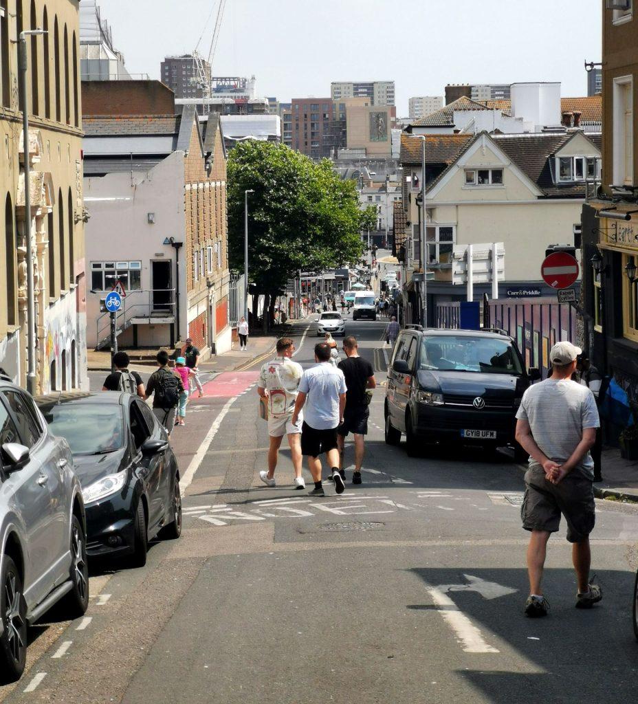A busy Church Street has many people walking it and many parked cars. (Source: Jasmine Cook, 2022)