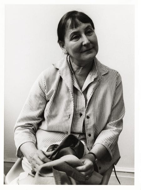 Black and white portrait of Marianne Straub in a stripey shirt and jacket