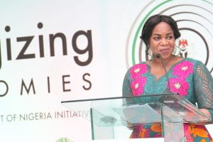 Photo of Damilola Ogunbiyi at a lecturn giving a speech