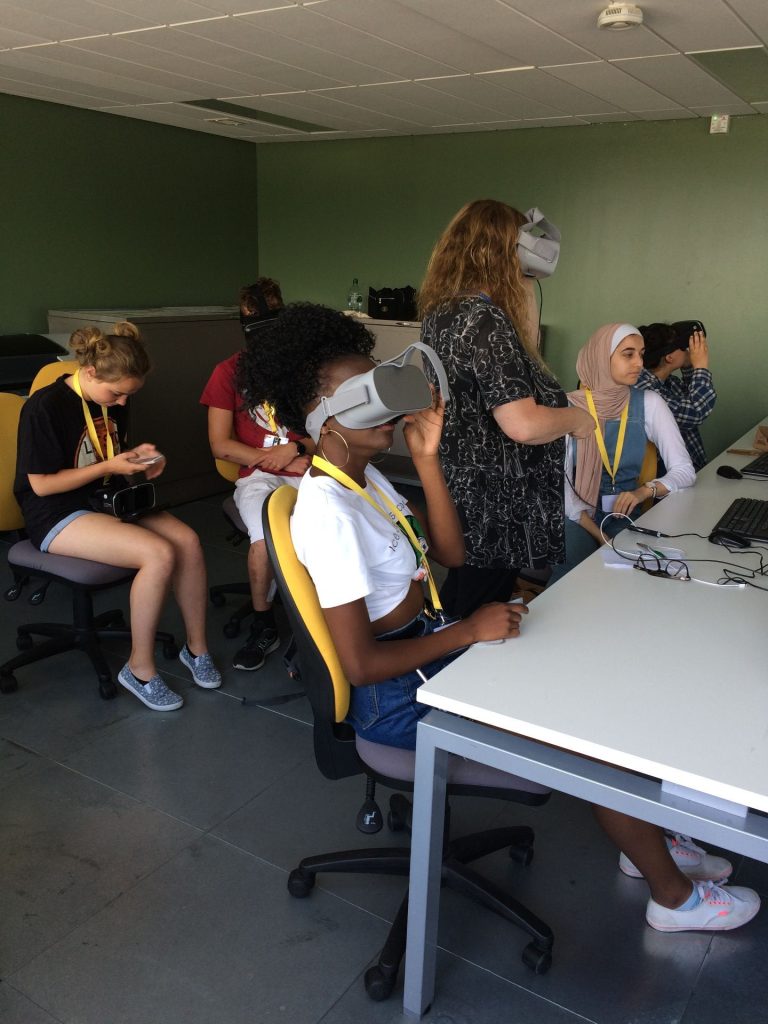 Group of young people using VR headsets