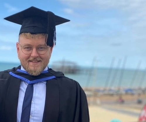 Tom King at graduation on Brighton seafront